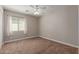 Well lit, empty bedroom with neutral carpet and paint at 3580 E Kesler Ln, Gilbert, AZ 85295