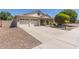 Charming single-Gathering home featuring a three-car garage and a well-manicured front yard at 3580 E Kesler Ln, Gilbert, AZ 85295