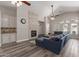 Inviting living room with a stone fireplace, ceiling fan, and comfortable seating at 3580 E Kesler Ln, Gilbert, AZ 85295