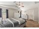 Spacious bedroom with neutral tones, ceiling fan, and large window offering plenty of natural light at 3580 E Kesler Ln, Gilbert, AZ 85295
