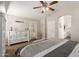 A neutral bedroom with ceiling fan and access to the ensuite bathroom provides a relaxing retreat at 3580 E Kesler Ln, Gilbert, AZ 85295