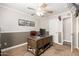 Home office setup with rustic desk, neutral paint, and fan at 3580 E Kesler Ln, Gilbert, AZ 85295