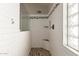 Modern tiled walk-in shower features a glass divider and a mosaic tile accent stripe at 3580 E Kesler Ln, Gilbert, AZ 85295