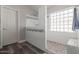 Tiled walk-in shower featuring a pebble floor and a glass block window at 3580 E Kesler Ln, Gilbert, AZ 85295