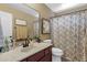 Well-maintained bathroom features a single sink vanity, and a shower with a curtain at 3828 S Verbena Ave, Gilbert, AZ 85297
