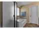 Beautiful bathroom featuring a tub, separate shower, and frosted glass door at 3828 S Verbena Ave, Gilbert, AZ 85297