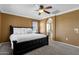 Spacious bedroom offers a ceiling fan and easy access to the ensuite bathroom at 3828 S Verbena Ave, Gilbert, AZ 85297