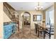 Inviting dining area features a chandelier, a stylish table setting, and easy access to the staircase and living area at 3828 S Verbena Ave, Gilbert, AZ 85297