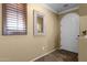 Bright entryway featuring tile flooring, a decorative mirror and a white door at 3828 S Verbena Ave, Gilbert, AZ 85297