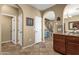 Hallway featuring tile flooring and arched doorway looking into the kitchen at 3828 S Verbena Ave, Gilbert, AZ 85297