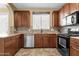 Kitchen showcasing granite countertops, tiled backsplash, and stainless steel appliances at 3828 S Verbena Ave, Gilbert, AZ 85297