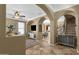 Open living area featuring tile flooring, neutral decor, and seamless flow to other spaces at 3828 S Verbena Ave, Gilbert, AZ 85297