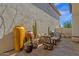 Inviting patio area with lush desert landscaping and stylish outdoor furniture at 3828 S Verbena Ave, Gilbert, AZ 85297