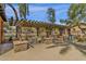 Covered patio area with outdoor seating and BBQ, perfect for community gatherings at 3828 S Verbena Ave, Gilbert, AZ 85297
