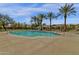 Serene community pool area with a cabana, seating, and lush landscaping at 3828 S Verbena Ave, Gilbert, AZ 85297