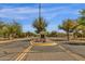 Attractive community entrance with mature trees and well-kept landscaping at 3828 S Verbena Ave, Gilbert, AZ 85297