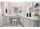 Bright bathroom with vanity, mirrors, drawers and shelving at 4106 W Mission Ln, Phoenix, AZ 85051