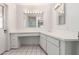 Bright bathroom featuring a large mirror, well-lit vanity, and ample counter space at 4106 W Mission Ln, Phoenix, AZ 85051