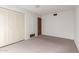 Cozy bedroom with carpeted floors, closet, and a standard ceiling light fixture at 4106 W Mission Ln, Phoenix, AZ 85051
