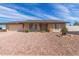Charming single-story home with a brick and beige facade, complemented by a well-maintained, desert-landscaped front yard at 4106 W Mission Ln, Phoenix, AZ 85051