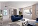 Staged living room showcasing modern decor and a spacious layout with natural lighting at 4106 W Mission Ln, Phoenix, AZ 85051