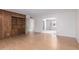 Spacious living room with hardwood floors and built-in bookshelf at 4106 W Mission Ln, Phoenix, AZ 85051