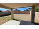 View of backyard from covered patio featuring gravel and a block wall at 419 W Harwell Rd, Phoenix, AZ 85041
