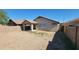 View of backyard featuring gravel and a covered patio with a block wall at 419 W Harwell Rd, Phoenix, AZ 85041