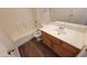 Bathroom featuring a wood cabinet vanity, toilet, and shower-tub combination at 419 W Harwell Rd, Phoenix, AZ 85041