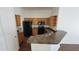 Functional kitchen featuring ample cabinet space, black appliances, and a convenient breakfast bar at 419 W Harwell Rd, Phoenix, AZ 85041