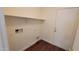Laundry room features a white shelf, hookups, and access to a side exterior door at 419 W Harwell Rd, Phoenix, AZ 85041