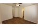 Open living space with hardwood flooring and neutral walls, offering a versatile layout at 419 W Harwell Rd, Phoenix, AZ 85041