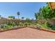 Well-maintained backyard with plants, gravel, and fence at 4233 W Michigan Ave, Glendale, AZ 85308