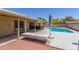 Backyard featuring pool, hot tub, covered patio, and lounging area at 4233 W Michigan Ave, Glendale, AZ 85308