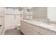 Updated bathroom with walk-in shower, double sinks and granite countertops at 4233 W Michigan Ave, Glendale, AZ 85308