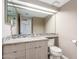 Neutral bathroom featuring a modern vanity with granite countertop and a decorative backsplash at 4233 W Michigan Ave, Glendale, AZ 85308