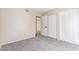 A neutral bedroom has carpet flooring, closet, and doorway at 4233 W Michigan Ave, Glendale, AZ 85308