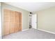 Spacious bedroom with large closet and doorway leading to bathroom at 4233 W Michigan Ave, Glendale, AZ 85308