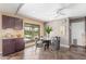 Cozy dining area with dark cabinets, tile floors, and views of the backyard at 4233 W Michigan Ave, Glendale, AZ 85308