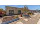 Inviting single-story home featuring xeriscape landscaping, mature trees, and stone walkway at 4233 W Michigan Ave, Glendale, AZ 85308