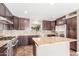 Well-equipped kitchen with stainless steel appliances, granite countertops, and ample cabinet space at 4233 W Michigan Ave, Glendale, AZ 85308