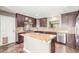 Modern kitchen with stainless steel appliances, granite countertops, and a center island at 4233 W Michigan Ave, Glendale, AZ 85308
