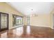 Spacious living room featuring vaulted ceilings, ample natural light, and decorative windows at 4233 W Michigan Ave, Glendale, AZ 85308