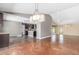 Spacious open-concept living area, kitchen, and dining room, with modern lighting at 4233 W Michigan Ave, Glendale, AZ 85308
