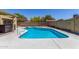 Inviting pool with diving board in a fenced backyard at 4233 W Michigan Ave, Glendale, AZ 85308