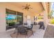 Open back patio with outdoor seating area and a view of the pool at 43612 W Chambers Ct, Maricopa, AZ 85138