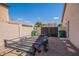 Practical backyard with trailer, storage, and gated access, perfect for utility and convenience at 43612 W Chambers Ct, Maricopa, AZ 85138