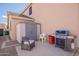 Well-organized backyard featuring a shed, seating area, and barbecue grill, ideal for outdoor activities and storage at 43612 W Chambers Ct, Maricopa, AZ 85138