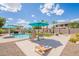 Expansive backyard featuring a pool, patio, manicured lawn, and outdoor seating, ideal for entertaining and relaxation at 43612 W Chambers Ct, Maricopa, AZ 85138
