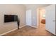 Bedroom features a tile floor and mount for a television at 43612 W Chambers Ct, Maricopa, AZ 85138